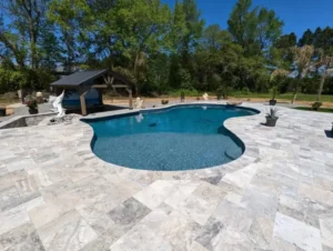 Sunken poolside bar with marble flooring built by Coastal Pools in Delaware