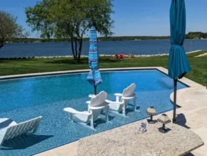 Tanning ledge with chairs built by Coastal Pools in Delaware